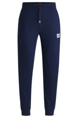 Cotton-blend tracksuit bottoms with metallic logo label