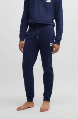 Cotton-blend tracksuit bottoms with metallic logo label