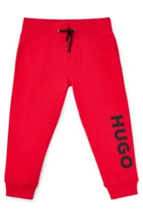 Kids' fleece tracksuit bottoms with vertical logo