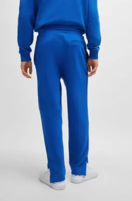 Loose-fit cotton-terry tracksuit bottoms with outline logo